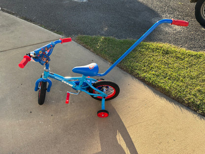 Paw patrol bike with removable parent handle