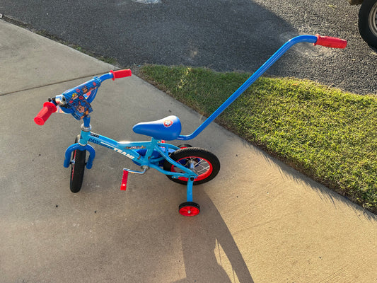 Paw patrol bike with removable parent handle