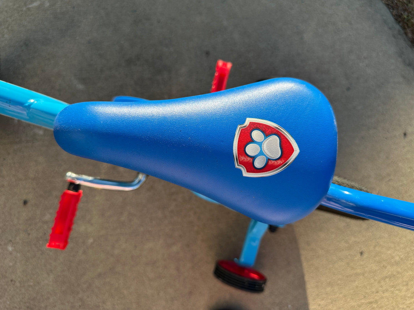 Paw patrol bike with removable parent handle